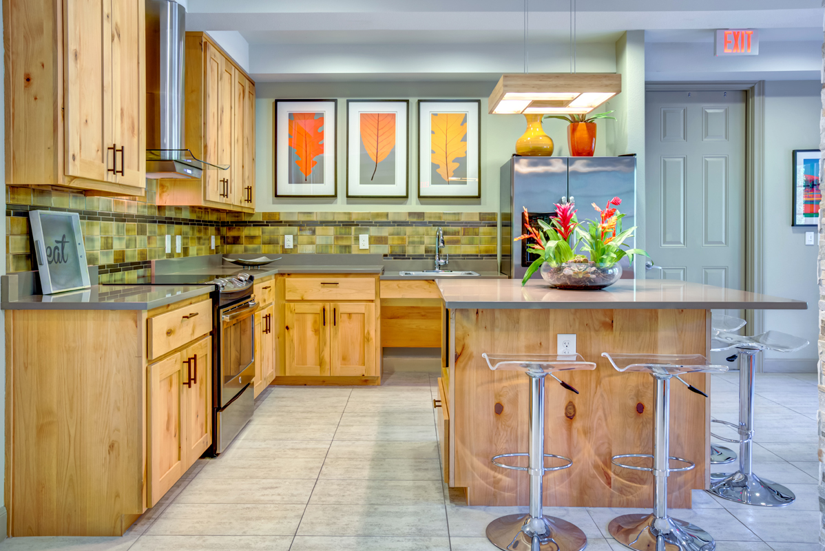Community kitchen with tiled floor, kitchen island, free WiFi, fridge, sink, microwave and oven 