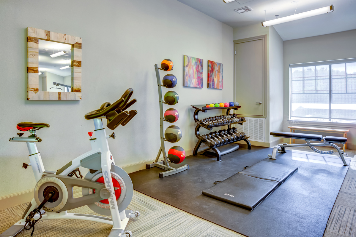 Fitness center with free weights and medicine balls