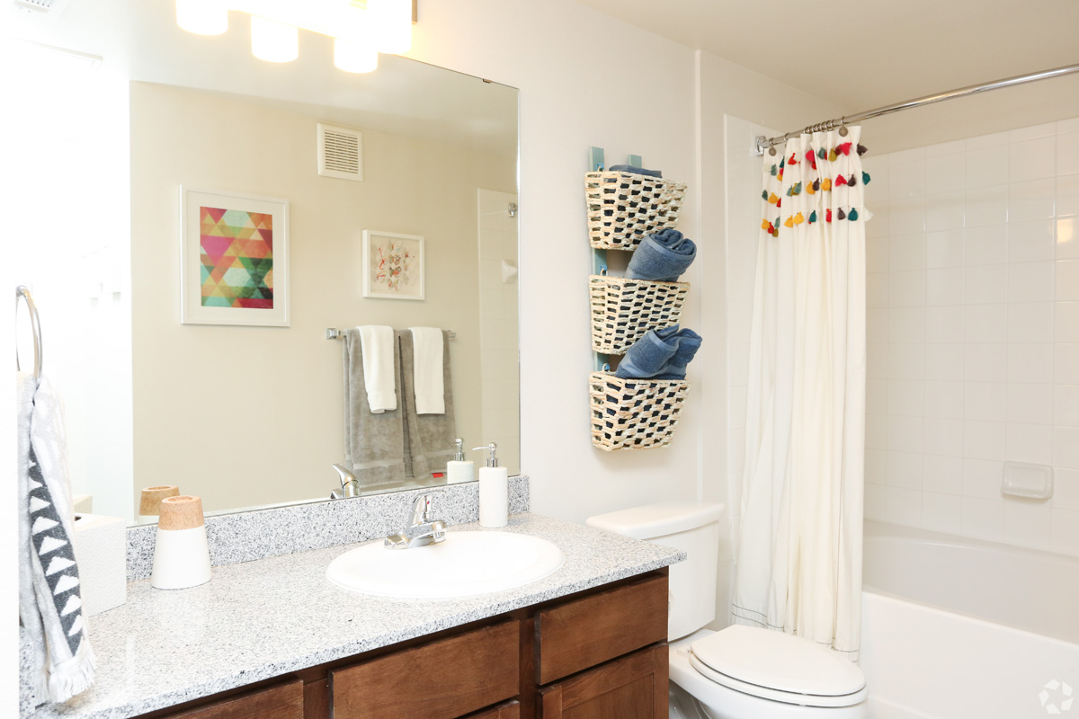 Model bathroom with granite countertops and soaking tub